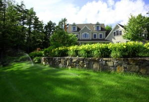 home with well landscaped lawn and active sprinkler system