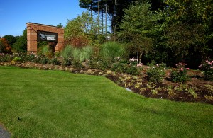 wright express sign with grass, lawn, garden, and plants