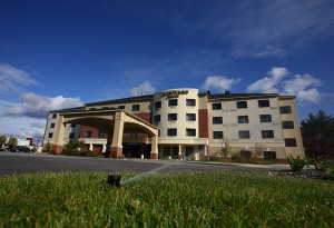 sprinklers watering hotel lawn and garden