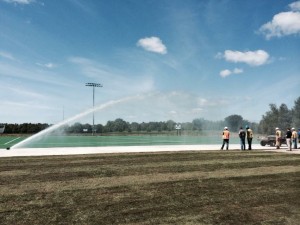 large irrigation system watering athletic field